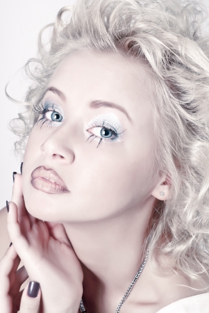 Attractive blond beauty portrait with original make up and hair dressの写真素材