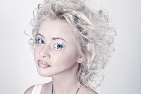 Attractive blond beauty portrait with original make up and hair dressの写真素材