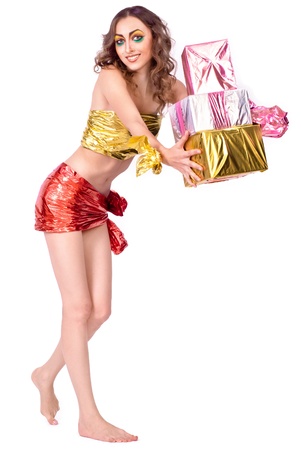 fashion smiling woman model with beauty bright make-up posing in studio with presentsの写真素材