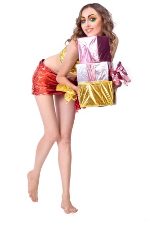 fashion smiling woman model with beauty bright make-up posing in studio with presentsの写真素材