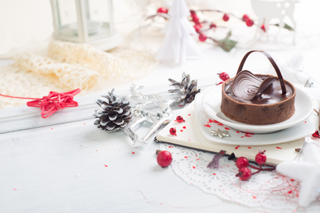 Beautiful Chocolate tart over Christmas backgroundの写真素材