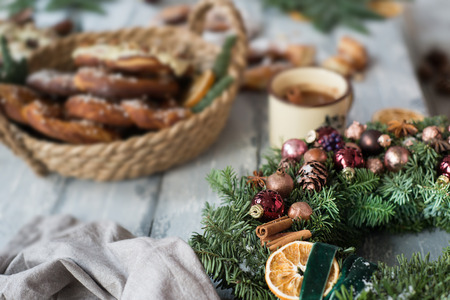 Christmas background with Christmas wreath and pretzel over woodの写真素材