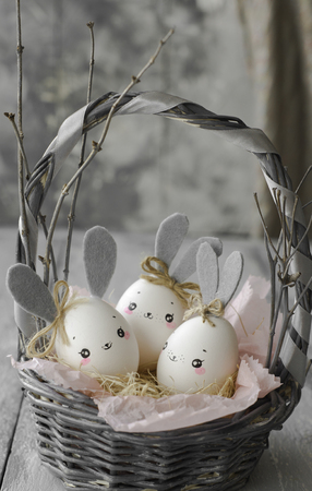 Easter decoration for home, handmade work, cute eggshell rabbit in a basket, beautiful  for card designの写真素材