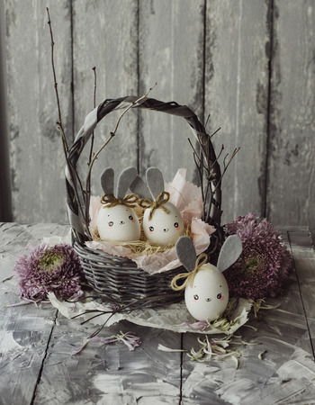 Easter decoration for home, handmade work, cute eggshell rabbit in a basket, beautiful  for card designの写真素材