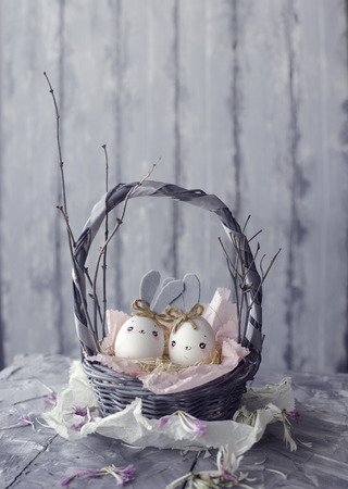 Easter decoration for home, handmade work, cute eggshell rabbit in a basket, beautiful  for card designの写真素材
