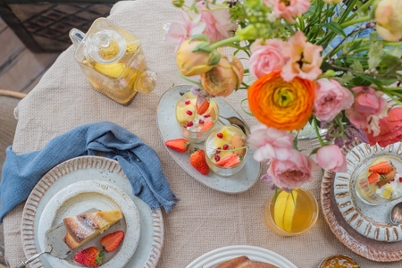 Cake, Pastry with blueberrys arranged on table with flowers and fruits, top viewの写真素材