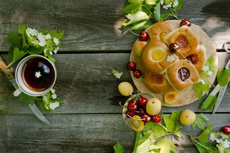 Baking with fruit filling over wood rustic  with cherry and apricot, Food still Life, Delicious Homemade tartの写真素材