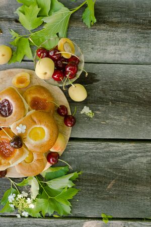 Baking with fruit filling over wood rustic  with cherry and apricot, Food still Life, Delicious Homemade tartの写真素材