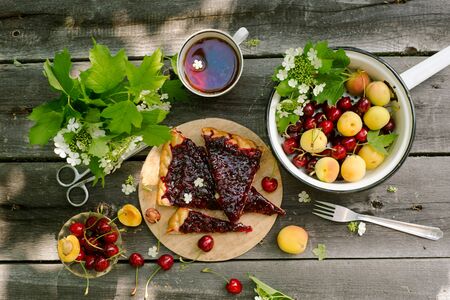 Cherry Pie over wood rustic  with cherry and apricot, Food still Life, Delicious Homemade tartの写真素材