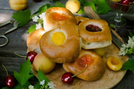 Baking with fruit filling over wood rustic  with cherry and apricot, Food still Life, Delicious Homemade tartの写真素材