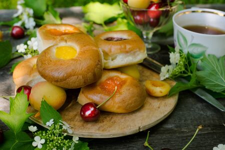 Baking with fruit filling over wood rustic  with cherry and apricot, Food still Life, Delicious Homemade tartの写真素材