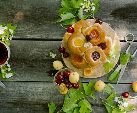 Baking with fruit filling over wood rustic  with cherry and apricot, Food still Life, Delicious Homemade tartの写真素材