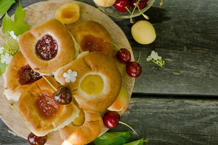 Baking with fruit filling over wood rustic  with cherry and apricot, Food still Life, Delicious Homemade tartの写真素材