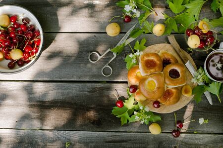Baking with fruit filling over wood rustic  with cherry and apricot, Food still Life, Delicious Homemade tartの写真素材
