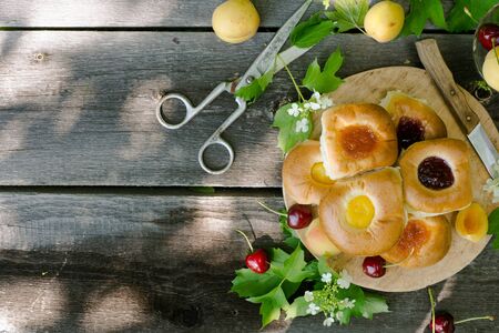 Baking with fruit filling over wood rustic  with cherry and apricot, Food still Life, Delicious Homemade tartの写真素材