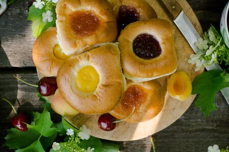 Baking with fruit filling over wood rustic  with cherry and apricot, Food still Life, Delicious Homemade tartの写真素材