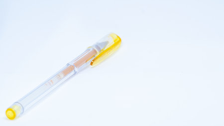 yellow pen isolated on white backgroundの写真素材