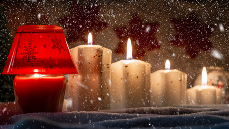 bright yellow decorative candle with christmas globesの写真素材