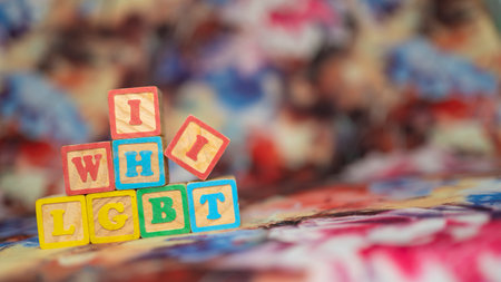 alphabetical letters placed on colored wooden cubes forming the word LGBTQの写真素材
