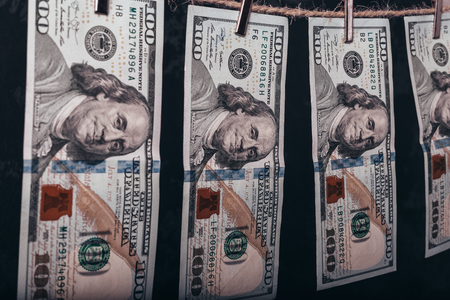 Money Laundering. Money Laundering US dollars hung out to dry. 100 dollar bills hanging on clotheslinesの写真素材