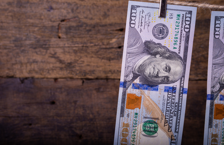 Money Laundering. Money Laundering US dollars hung out to dry. 100 dollar bills hanging on clotheslinesの写真素材