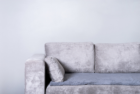 Comfortable sofa on grey wall backgroundの写真素材