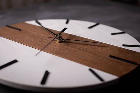 wall wooden clock at gray background texture
