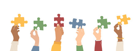 teamwork. Multi-ethnic group holding puzzles. The concept of cooperation and partnership. flat style. vector illustrationのイラスト素材