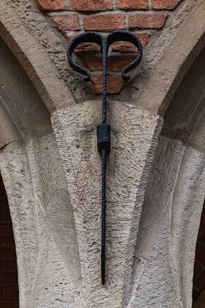 Concrete arch on a Brick Wall with steel elements. Historical Architecture