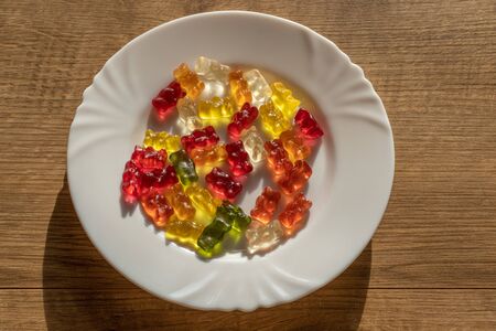 Sunny Jelly Bears on white plate from top viewの写真素材