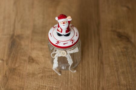 Porcelian Santa Claus on transparent Christmas jarの写真素材