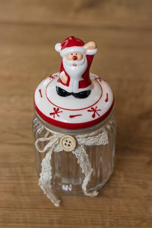 Christmas jar with a red porcelian Santaの写真素材