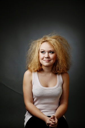 Funny young woman with a terrible haircutの写真素材