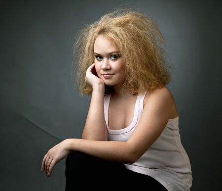 Funny young girl with a terrible haircutの写真素材