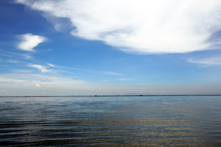 Blue sky with clouds over seaの写真素材