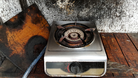 old broken dirty gas stove in kitchenの写真素材