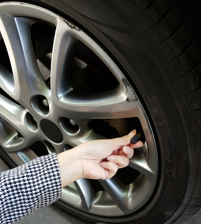 Tire air pressure checking before travelの写真素材