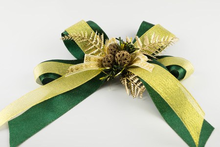 Green ribbon bow isolated on white backgroundの写真素材