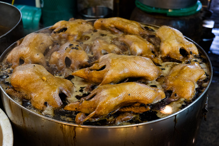 Boiling duck stewed in the gravy sauce in the potの写真素材