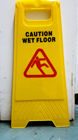 Sign showing warning of caution wet floorの写真素材