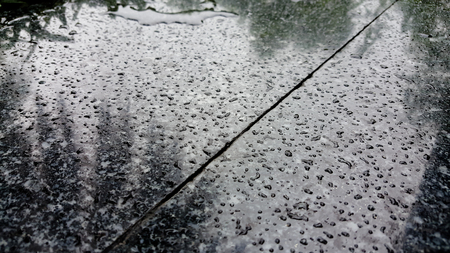 Water droplets on polished surfaceの写真素材