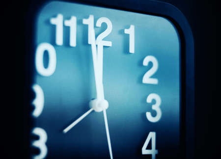 On a modern black watch, the hands show five minutes to midnight. It's time to go to bed. Night.の写真素材