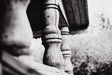 Black and white image of a wooden carved column in a Slavic hut. Rural architecture. village house.の写真素材