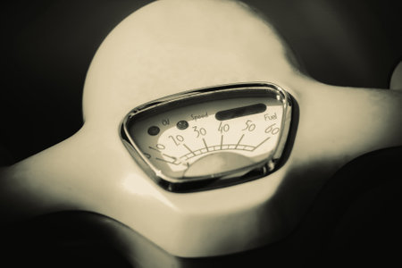 A photo with sepia filter on a speedometer of a retro motorcycle. Vintage transportation.の写真素材