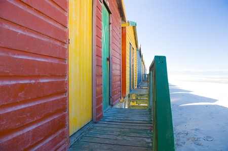 Brightly colored dressing huts on Muizenberg beach near Cape Town.の写真素材