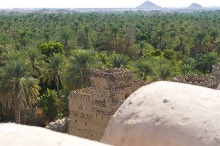 Ancient ruins from multiple tribal wars in Al Mudayrib in Oman, overlooking a date farm.の写真素材