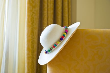 Inside of a luxurious hotel room with a Panama hat on the bed.の写真素材