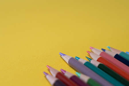 Color pencils on yellow backgroundの写真素材