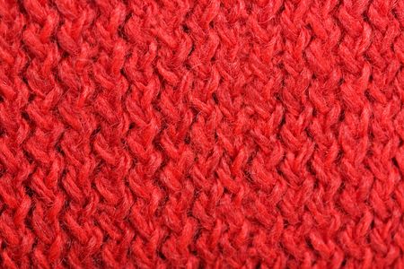 The woollen red yarn, knitting, needlework, is used as a structure の写真素材