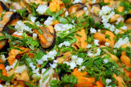 Mussels shells with garlic and spices ready for eatingの写真素材